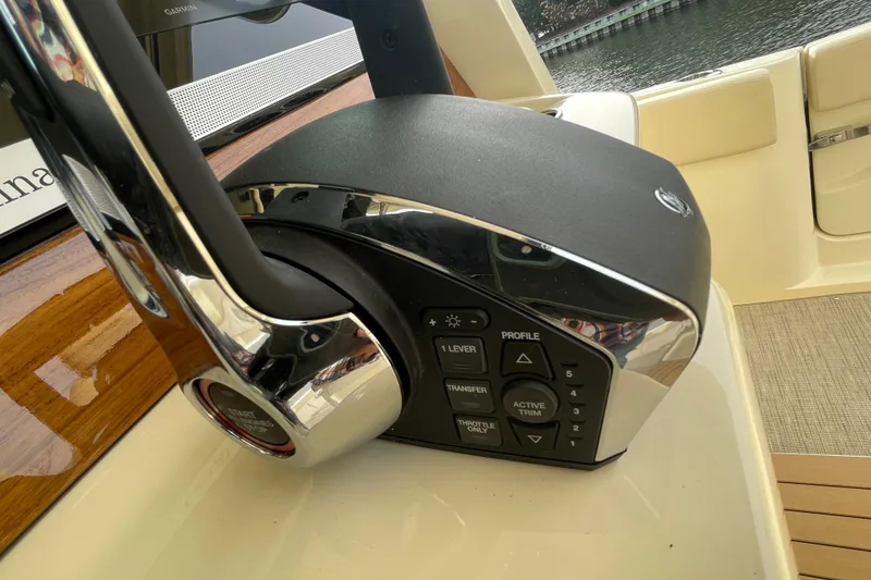 Slide: The Image of Control panel of 2026 Chris-Craft 310 Catalina boat with sleek design and buttons. - 80