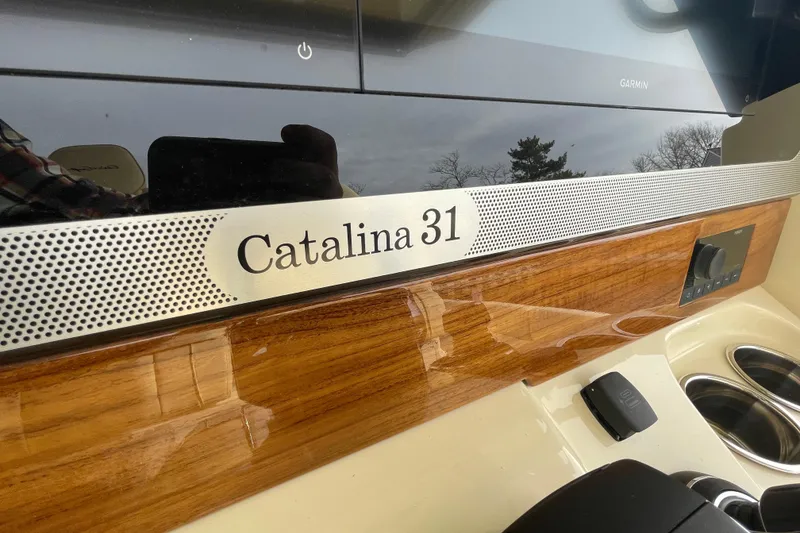 Slide: The Image of 2026 Chris-Craft 310 Catalina dashboard with wood finish and control panel. - 81