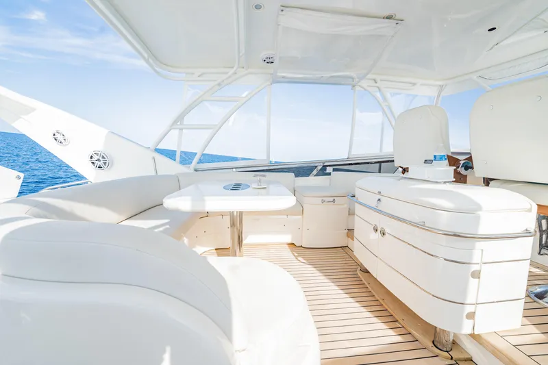 Slide: The Image of Luxurious 2004 Viking Princess Flybridge yacht interior with white seating and ocean view. - 10