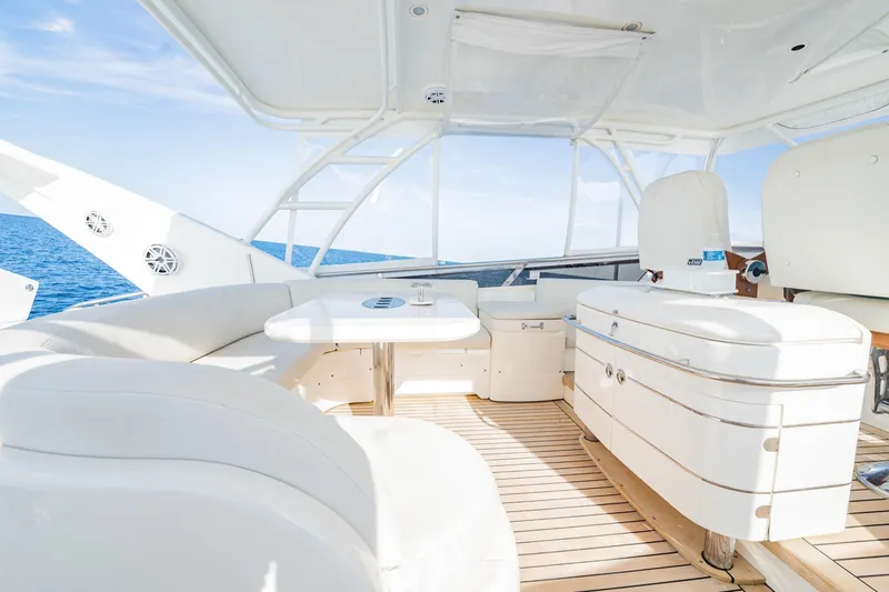 Slide: The Image of Luxurious 2004 Viking Princess Flybridge yacht interior with white seating and ocean view. - 14