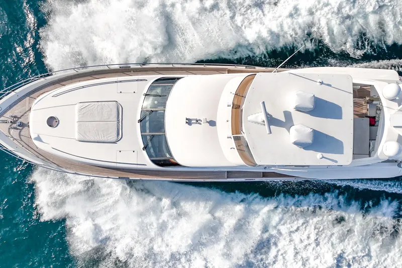 Slide: The Image of Aerial view of 2004 Viking Princess Flybridge yacht cruising on blue ocean waters. - 2