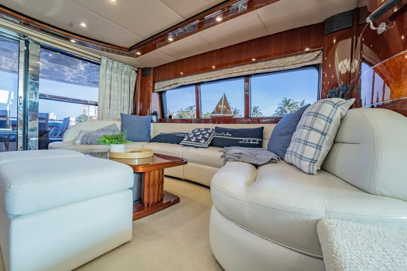 Slide: The Image of Luxurious 2004 Viking Princess Flybridge yacht interior with plush seating and elegant decor. - 20