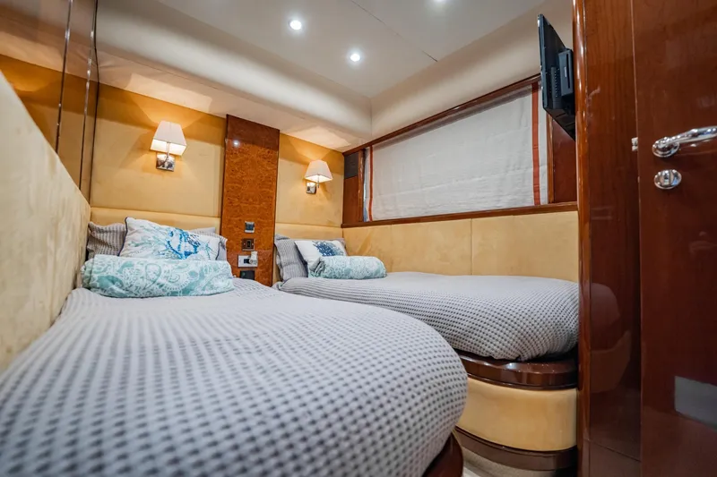 Slide: The Image of Luxurious 2004 Viking Princess Flybridge cabin with twin beds and elegant decor. - 39