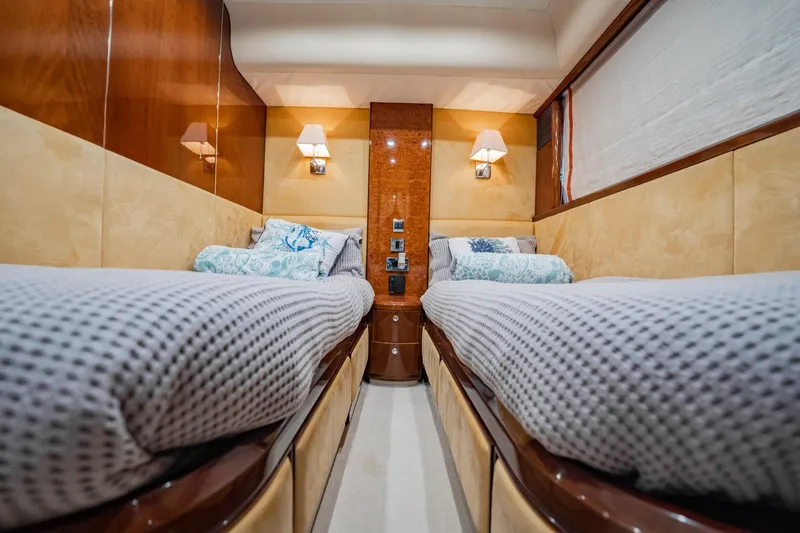 Slide: The Image of Luxurious twin cabin interior on 2004 Viking Princess Flybridge yacht, featuring elegant wood paneling. - 40