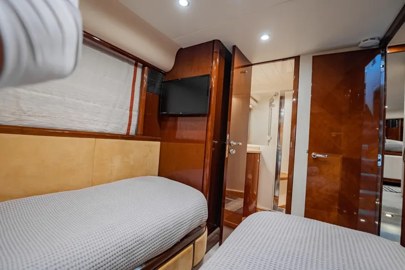 Slide: The Image of Luxurious 2004 Viking Princess Flybridge cabin with twin beds and modern amenities. - 41