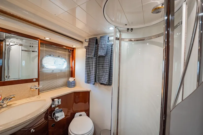 Slide: The Image of Luxurious 2004 Viking Princess Flybridge yacht bathroom with modern fixtures and elegant design. - 42