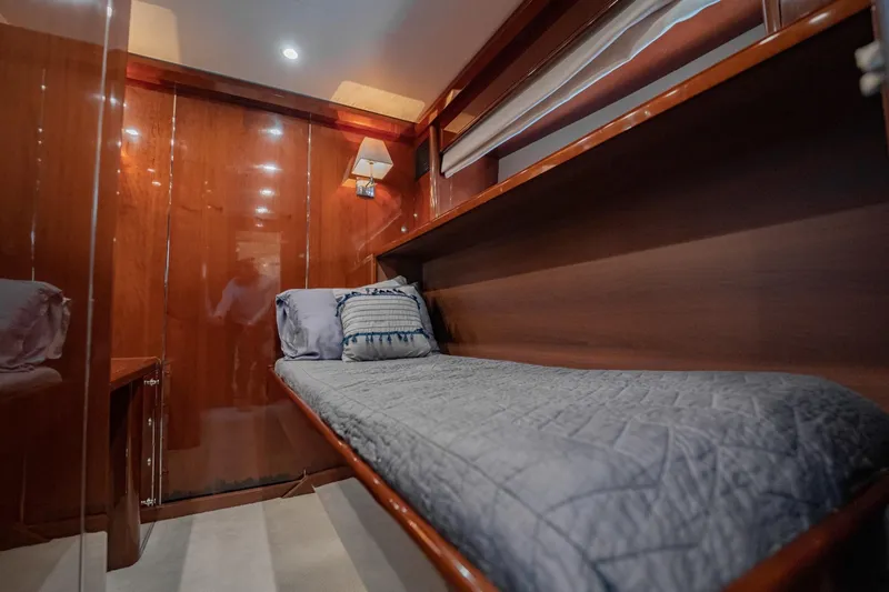 Slide: The Image of Luxurious cabin interior of 2004 Viking Princess Flybridge yacht with cozy bedding. - 44