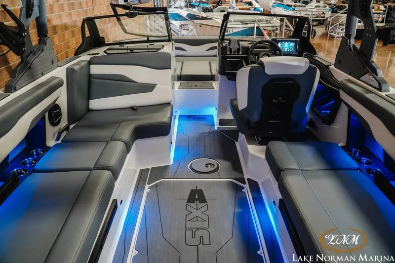 Slide: The Image of Luxurious interior of 2026 Axis T235 boat with blue LED lighting at Lake Norman Marina. - 10
