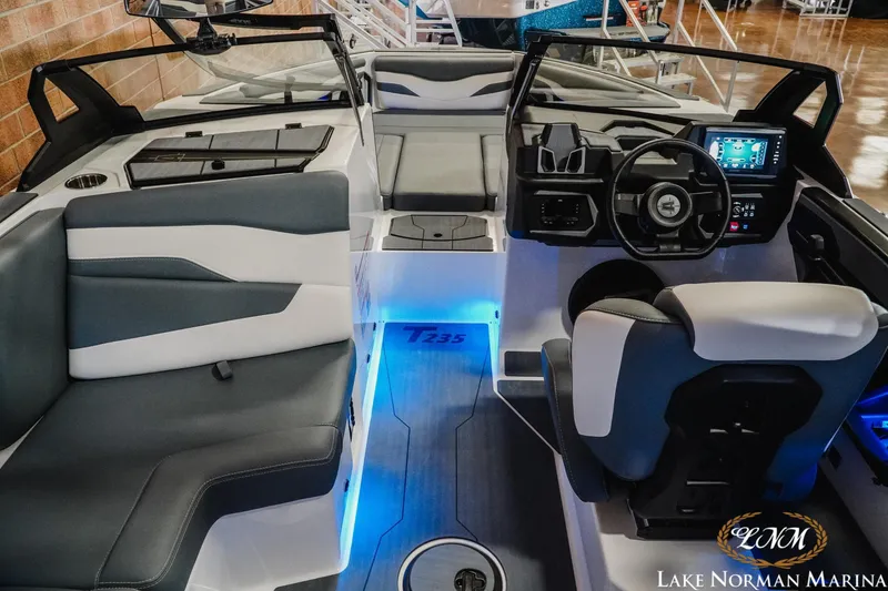 Slide: The Image of 2026 Axis T235 boat interior with modern dashboard and seating at Lake Norman Marina. - 14