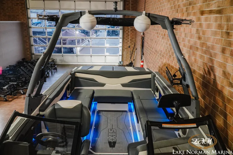 Slide: The Image of 2026 Axis T235 boat interior with blue LED lighting at Lake Norman Marina. - 19