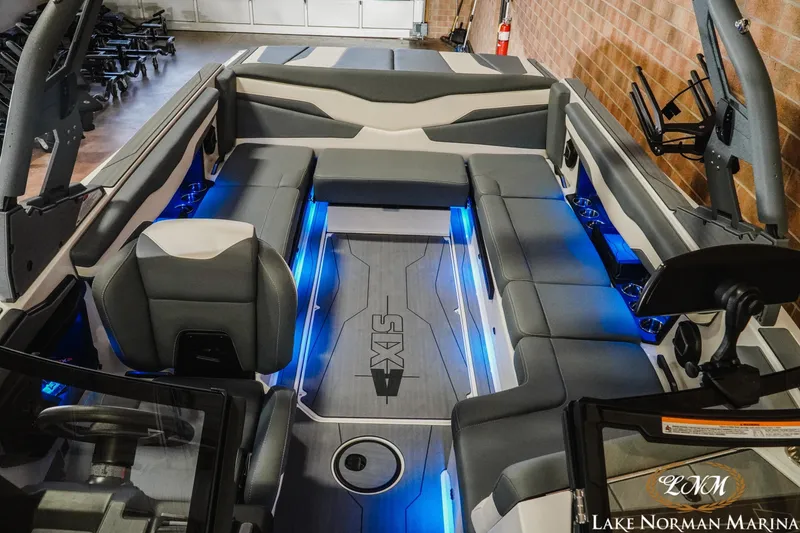 Slide: The Image of 2026 Axis T235 boat interior with gray seating and blue LED lighting. - 20