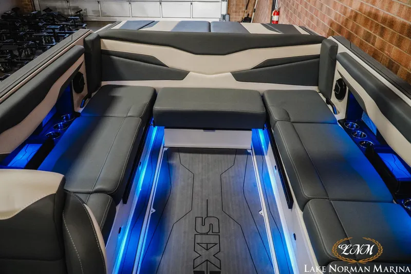 Slide: The Image of 2026 Axis T235 boat interior with sleek seating, blue LED lighting, and modern design. - 21