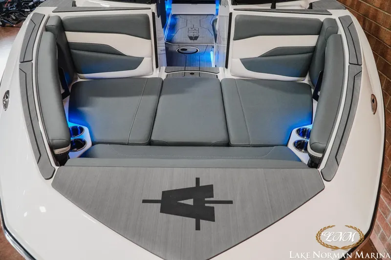 Slide: The Image of 2026 Axis T235 boat interior with gray seating and blue LED lighting. - 5