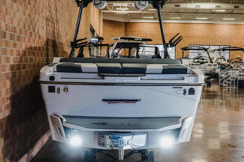 Slide: The Image of 2026 Axis T235 boat displayed indoors, showcasing sleek design and modern features. - 7