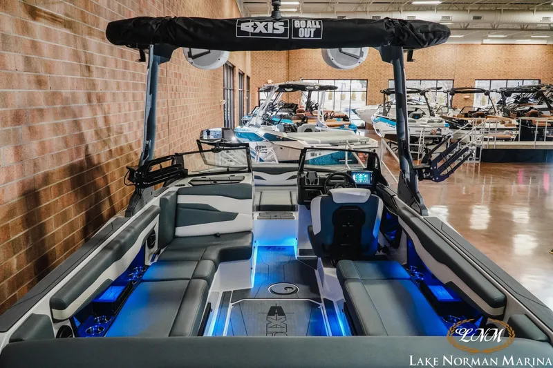 Slide: The Image of 2026 Axis T235 boat interior with blue LED lighting at Lake Norman Marina. - 8