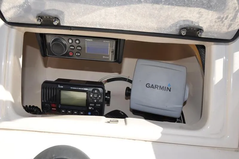 Slide: The Image of 2007 Grady-White Seafarer 226 boat electronics, featuring Garmin and Icom devices. - 22