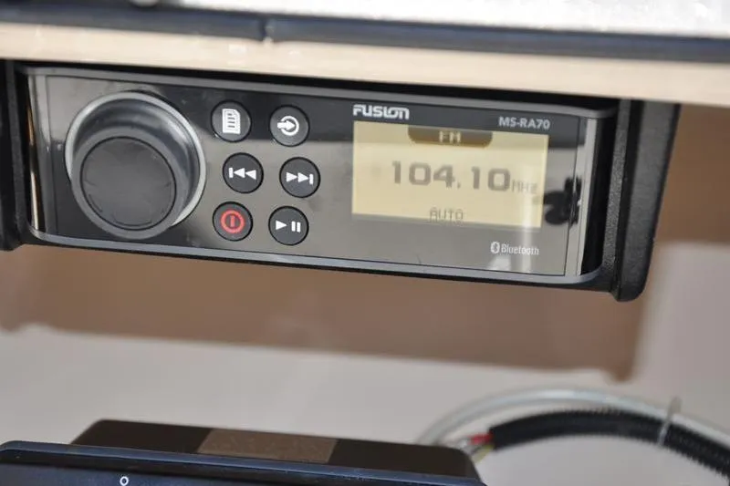 Slide: The Image of Fusion MS-RA70 radio display on 2007 Grady-White Seafarer 226, tuned to 104.10 FM. - 28