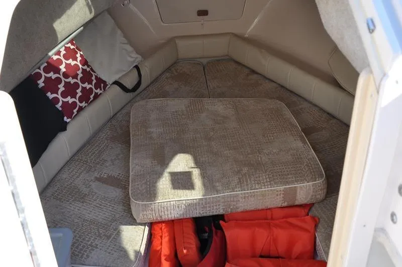 Slide: The Image of 2007 Grady-White Seafarer 226 cabin interior with cushions and life jackets. - 30