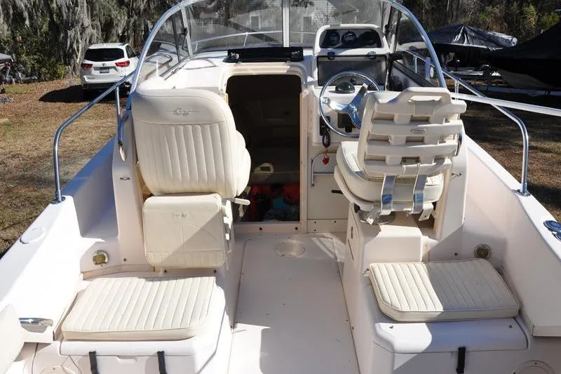 Slide: The Image of 2007 Grady-White Seafarer 226 boat interior with seating and steering wheel. - 8