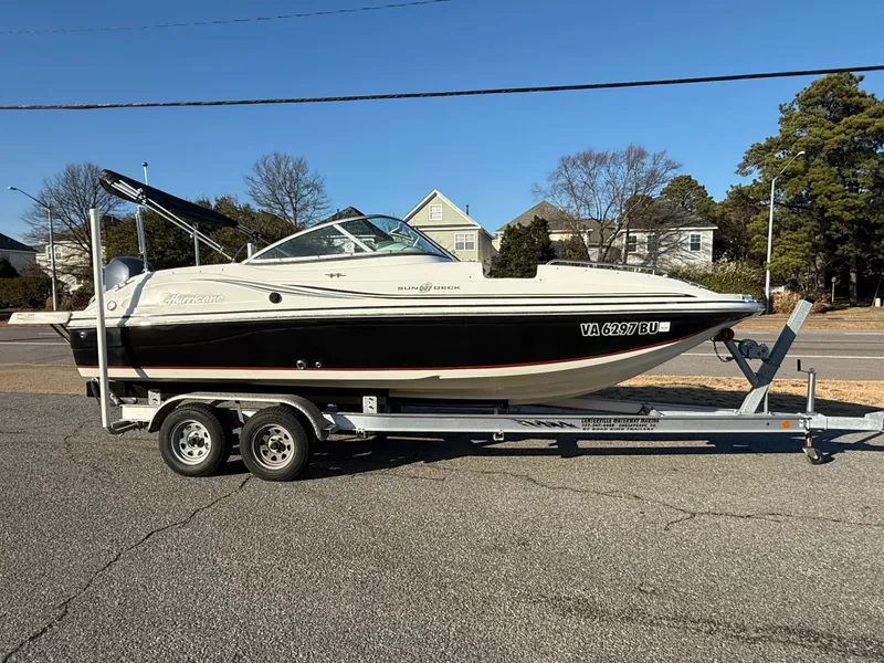 The Image of 2013 Hurricane 217 SunDeck OB on trailer, side view. - 0