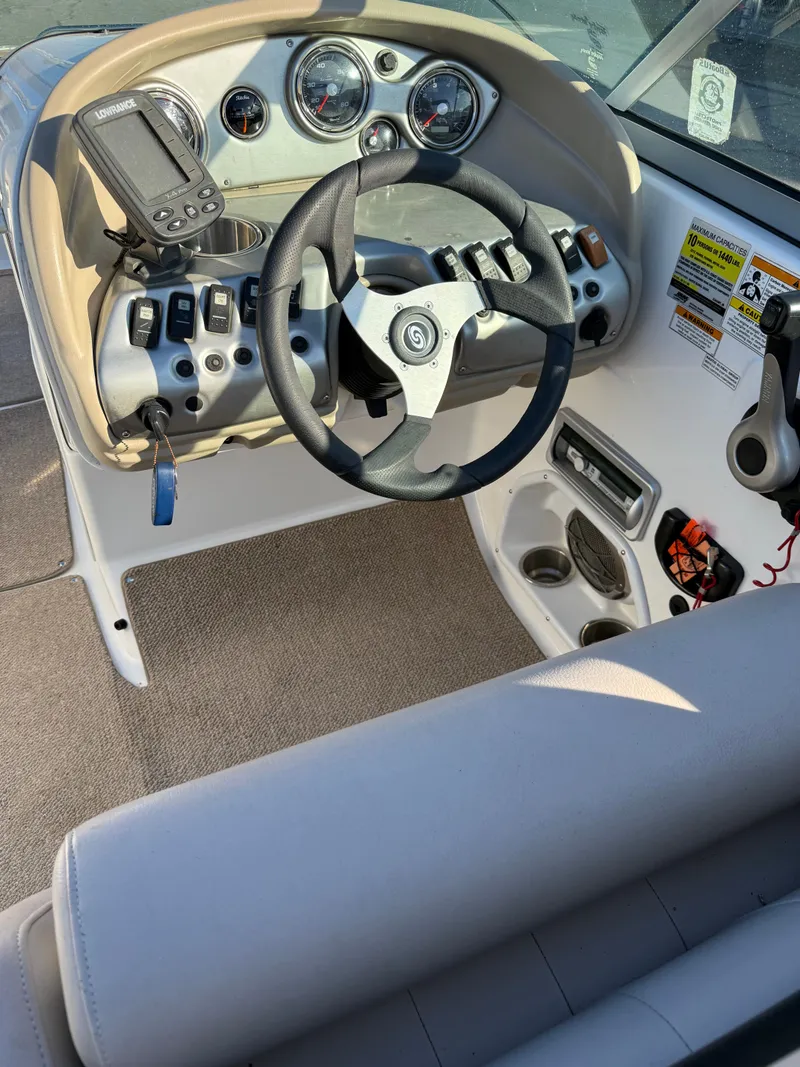 Slide: The Image of Cockpit of a 2013 Hurricane 217 SunDeck OB boat. - 7