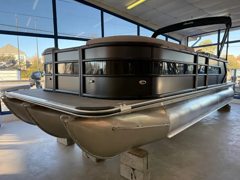 Slide: The Image of 2026 Bentley Pontoons 223 Bolt in showroom. - 2