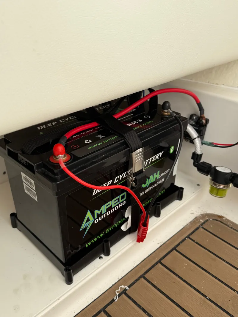 Slide: The Image of Amped Outdoors deep cycle battery in Tidewater 2500 Carolina Bay 2024. - 10