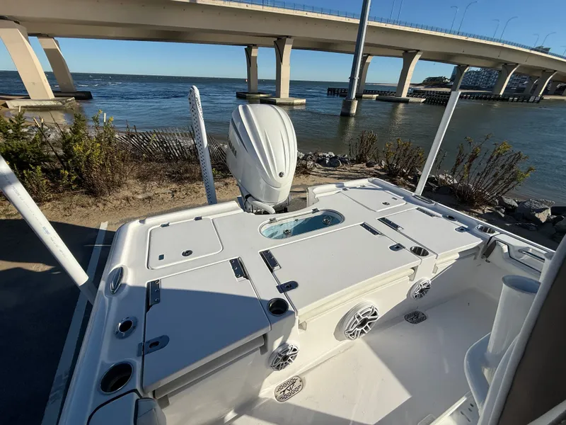 Slide: The Image of 2024 Tidewater 2500 Carolina Bay Custom boat near a bridge. - 13