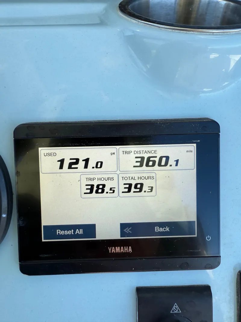 Slide: The Image of Yamaha display showing fuel usage and trip data on 2024 Tidewater boat. - 19