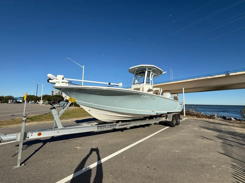 Slide: The Image of 2024 Tidewater 2500 Carolina Bay Custom boat on trailer by the water. - 5