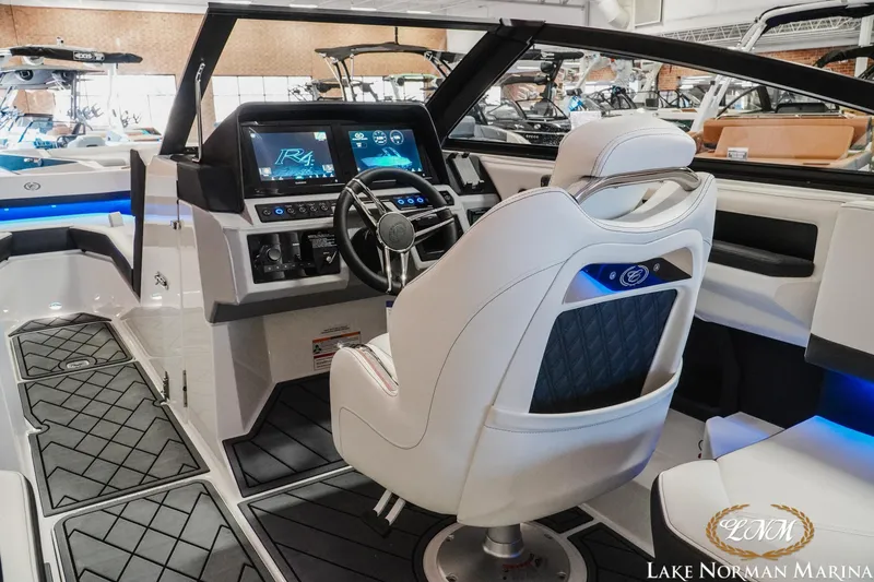 Slide: The Image of Interior of 2026 Cobalt R4 boat with modern dashboard and seating at Lake Norman Marina. - 10