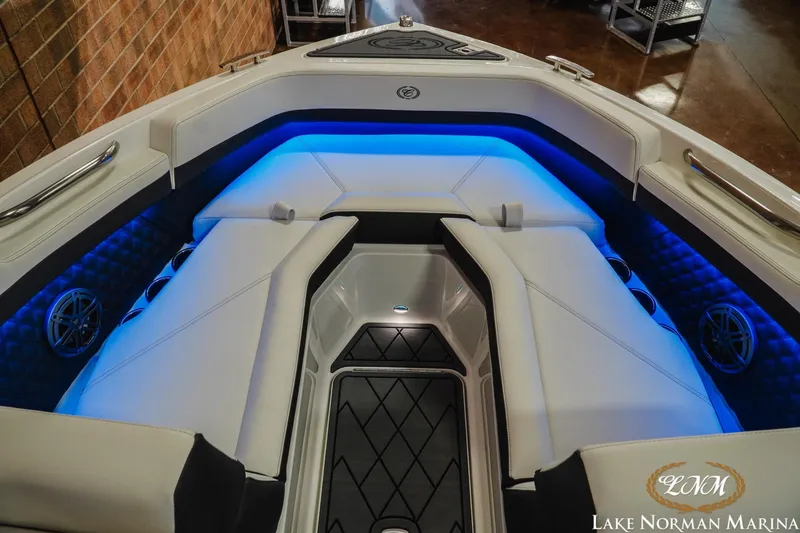 Slide: The Image of Luxurious interior of 2026 Cobalt R4 boat with blue LED lighting and plush seating. - 14