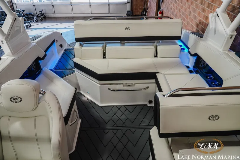 Slide: The Image of Luxurious interior of 2026 Cobalt R4 boat with white seating and ambient lighting. - 17