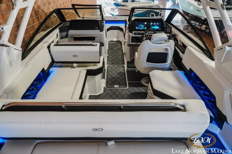 Slide: The Image of 2026 Cobalt R4 boat interior with modern seating and illuminated accents at Lake Norman Marina. - 7