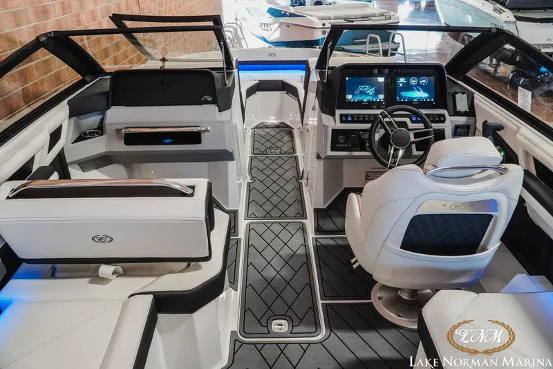 Slide: The Image of Interior of 2026 Cobalt R4 boat with modern dashboard and seating at Lake Norman Marina. - 9