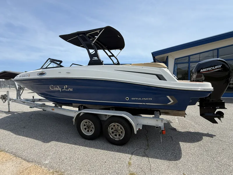 Slide: The Image of 2023 Bayliner VR6 boat on trailer, side view. - 2