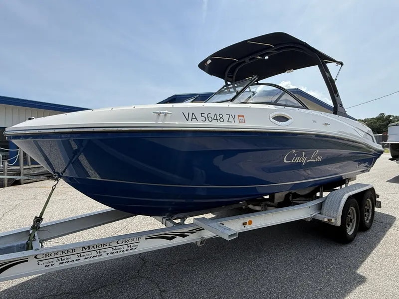 Slide: The Image of 2023 Bayliner VR6 boat on trailer, blue and white design. - 3