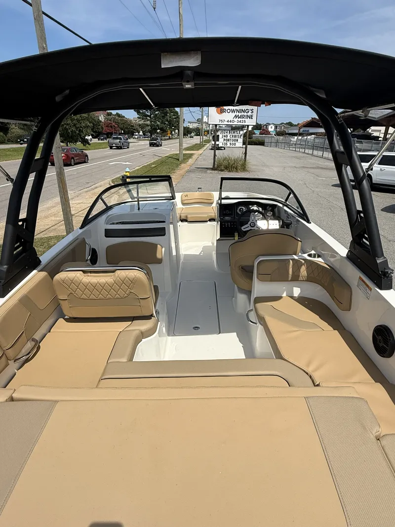 Slide: The Image of Interior view of a 2023 Bayliner VR6 boat with beige seating. - 4