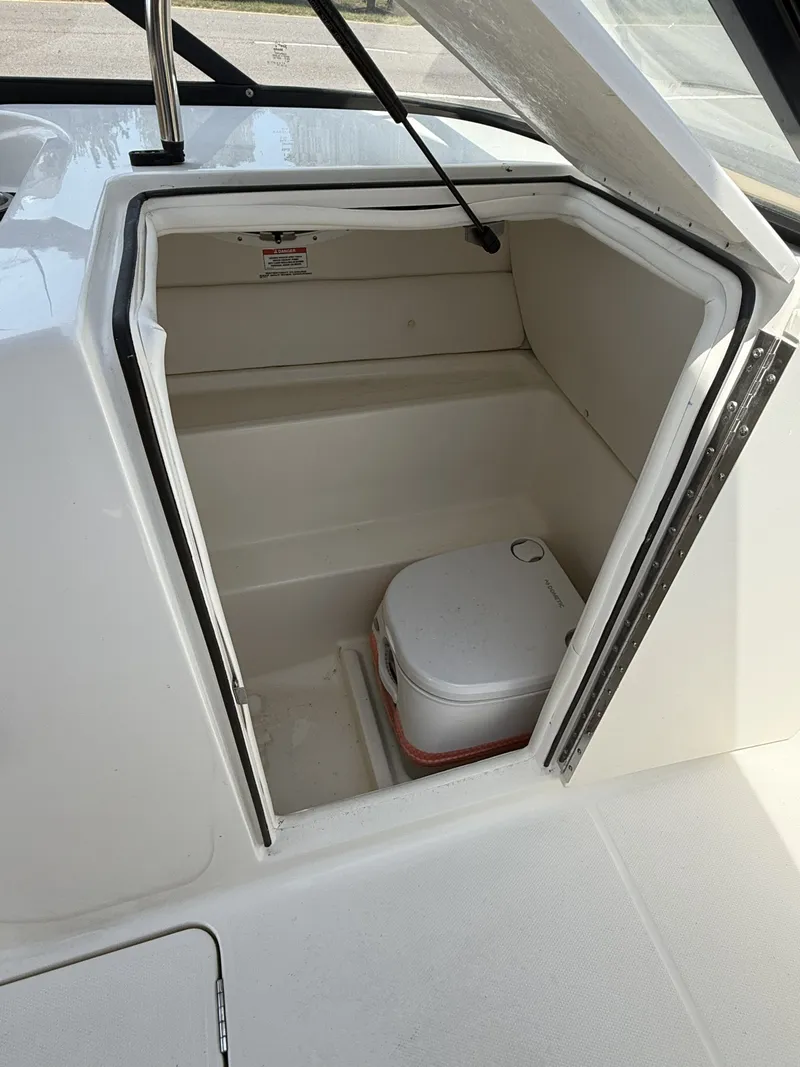 Slide: The Image of 2023 Bayliner VR6 boat cabin with portable toilet. - 5