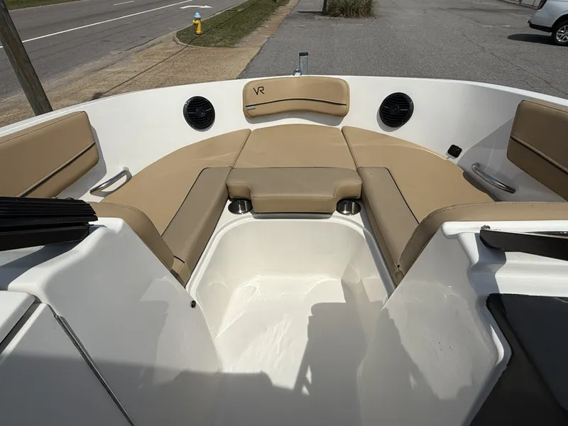 Slide: The Image of Interior view of 2023 Bayliner VR6 boat with beige seating. - 6