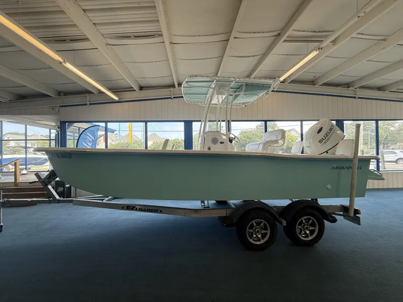 The Image of 2021 Savannah SS 21 boat on trailer in showroom. - 0