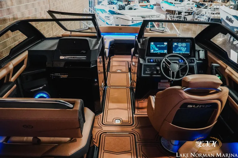 Slide: The Image of Interior of 2026 Cobalt R8 Surf boat with modern dashboard and luxurious seating. - 12