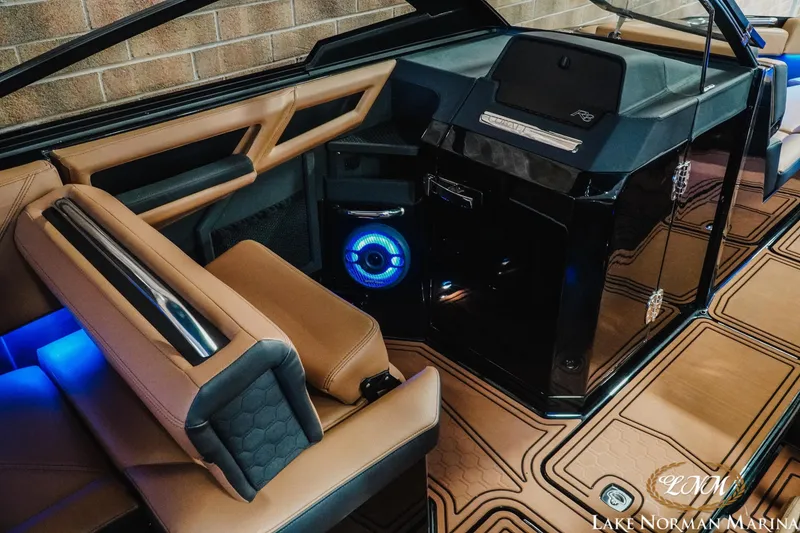 Slide: The Image of Luxurious interior of 2026 Cobalt R8 Surf boat with modern design and ambient lighting. - 14