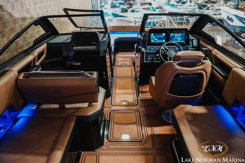 Slide: The Image of 2026 Cobalt R8 Surf boat interior with luxurious seating and advanced dashboard technology. - 9