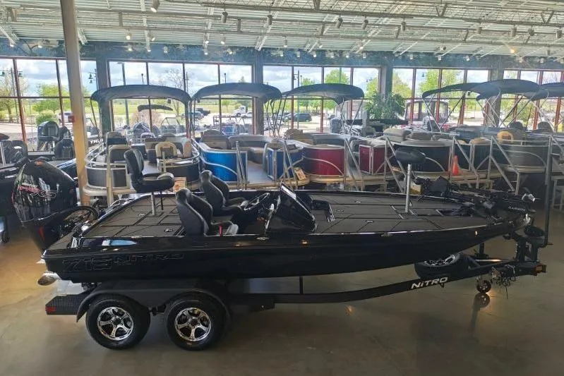 The Image of 2026 Nitro Z19 XL Pro boat displayed in a showroom with other boats. - 0