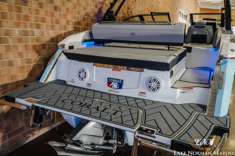 Slide: The Image of 2026 Cobalt R6 boat at Lake Norman Marina, featuring sleek design and spacious seating. - 10