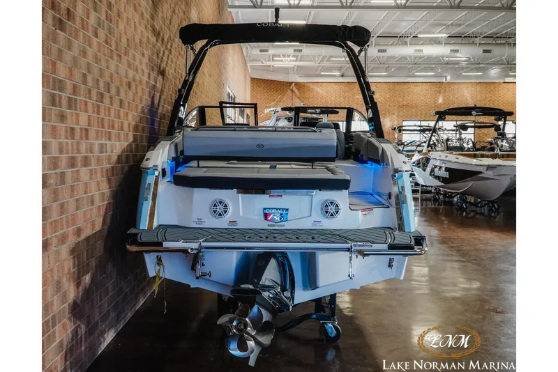 Slide: The Image of 2026 Cobalt R6 boat displayed indoors at Lake Norman Marina. - 11