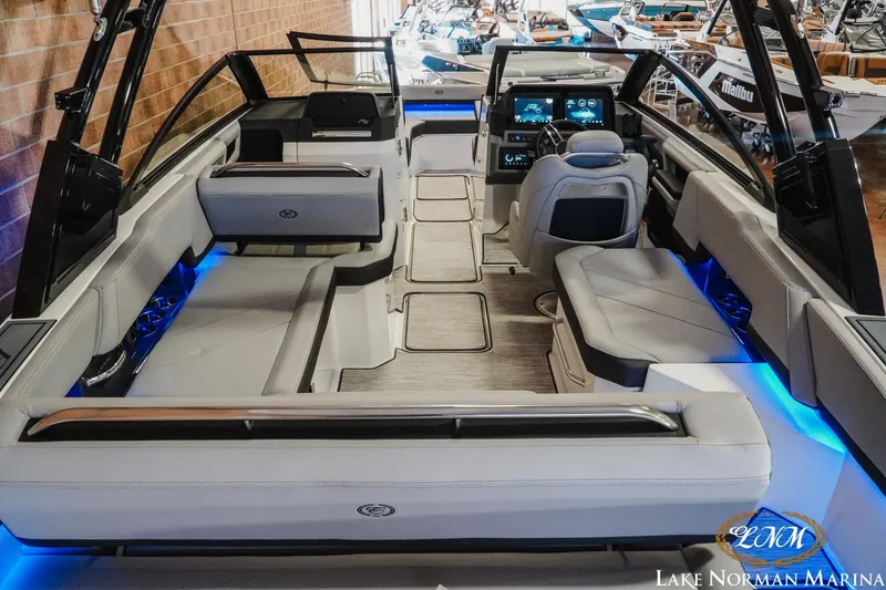 Slide: The Image of 2026 Cobalt R6 boat interior with modern seating and blue LED lighting at Lake Norman Marina. - 12