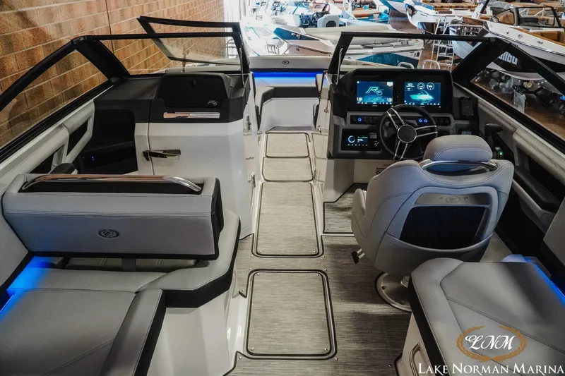 Slide: The Image of 2026 Cobalt R6 boat interior with modern dashboard and seating at Lake Norman Marina. - 14
