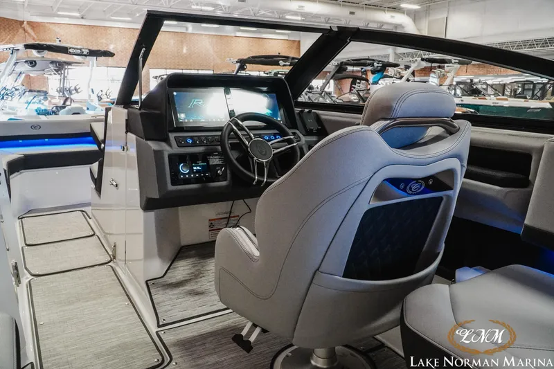 Slide: The Image of Interior of 2026 Cobalt R6 boat at Lake Norman Marina, featuring modern dashboard and seating. - 15